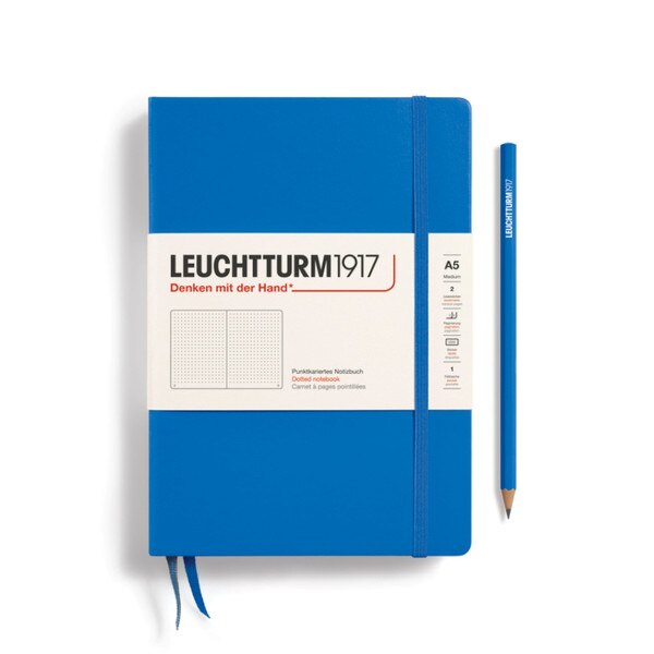 Sky blue hardcover dotted notebook with closure strap and two bookmarks.